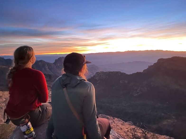Students watch the sunrise over the desert at Big Bend National Park.
