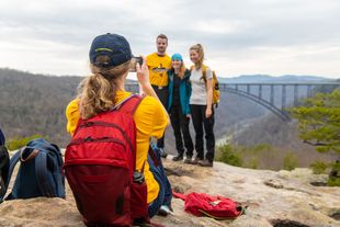 Student posing in front of New River Gorge