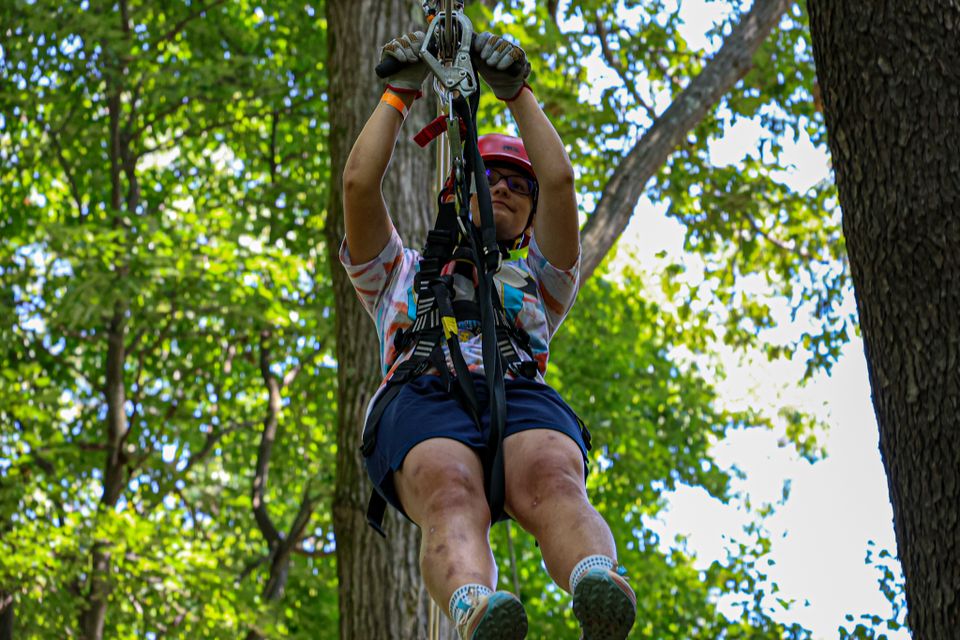 Girl on zipline at WVU canopy tour