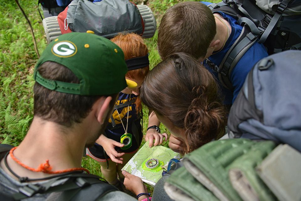 A group of Adventure WV participants looking at a map