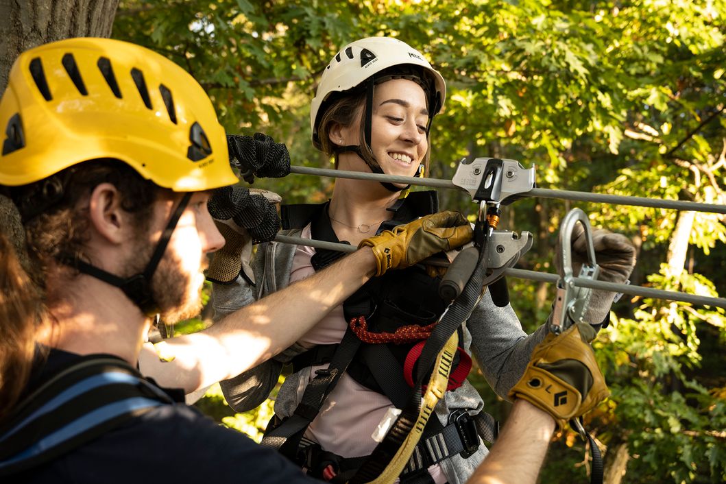 Hooking up onto a zipline at the Aerial Adventures