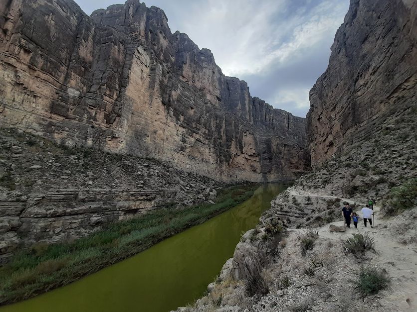 Tall canyon walls on either side of the Rio Grande River separated the United States and Mexico.