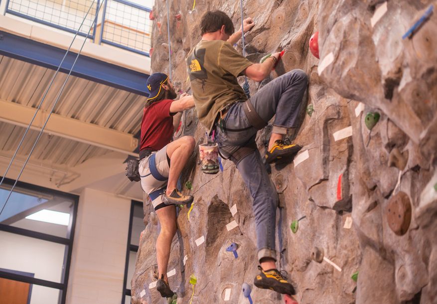 participants climbing on top rope at last year's climbing competition