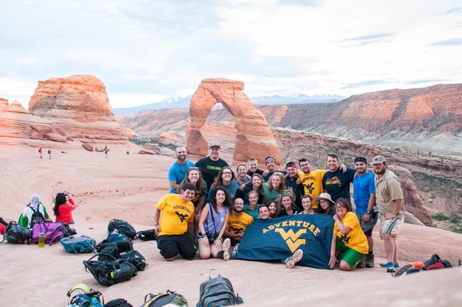 Students pose with the Adventure WV flag while in Utah.